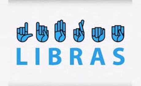Imagem com fundo branco com símbolos e mãos representando as letras da linguagem brasileira de sinais escrevendo LIBRAS