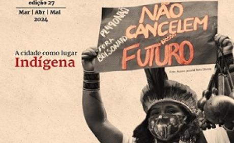 Indígena segurando um cartaz com a frase: não cancelem nosso futuro