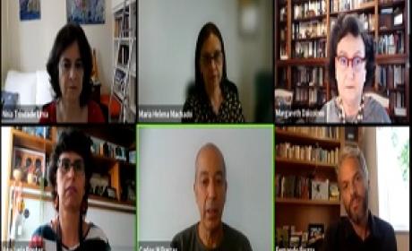 Imagem: Divulgação Rosto dos palestrantes na tela de um computador